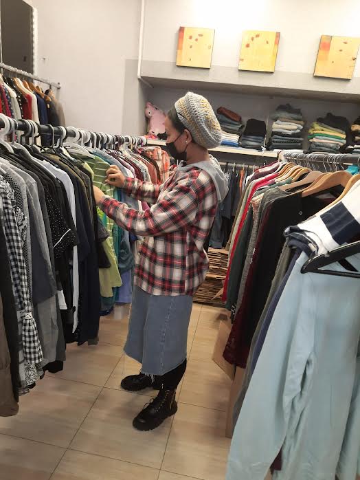Woman choosing some clothes at our clothing store LiVracha